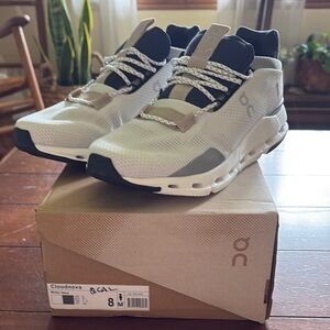 On Running Cream and Black Sneakers with Modern Design